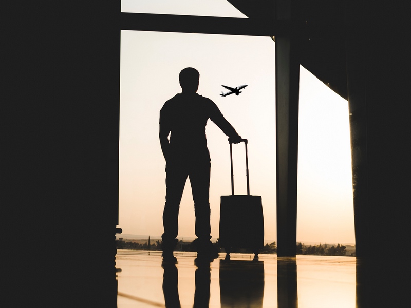Traveller with luggage at the airport